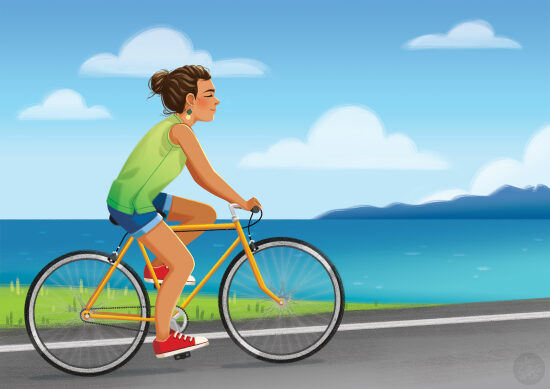 Femme à vélo sur la route le long de la mer