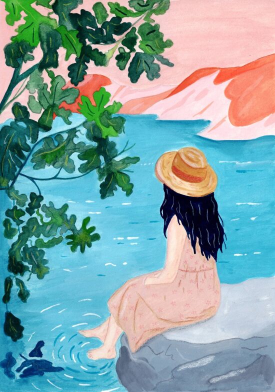 Femme assise près d'un lac